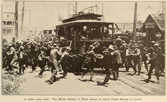 Strike scene from "The World Aflame," with Frank Keenan driving streetcar. (Motion Picture News, 16 August 1919, Page 1453)