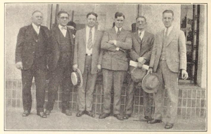 Roy Czerny (third from right, arms folded), ca. 1926. (Motion Picture News, 13 November 1926, Page 1876)