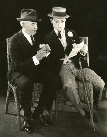 Langdon and Mack Sennett go over the comedian's movie contact, December 1923. (Courtesy University of Washington Special Collections, Order No. JWS24191)