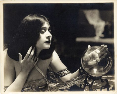 Theda Bara and her crystal ball, ca. 1917. (Photograph by Walter Seely, Witzel Studio)